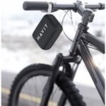 Black Havit SK874BT portable speaker hanging from bicycle handlebars